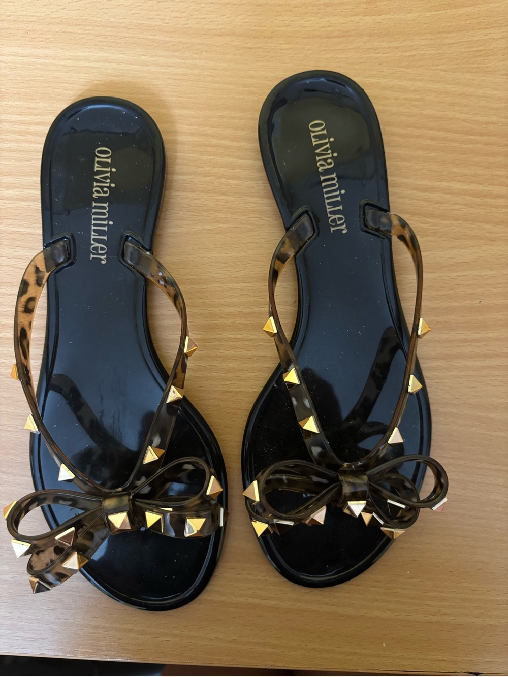 Olivia Miller Black/Brown Jelly Bow Sandals with Gold Stud Accents